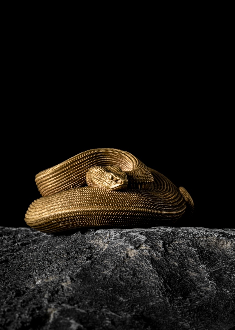 coppertist.wu hand engraves over 14,000 scales on this elegant viper bottle opener