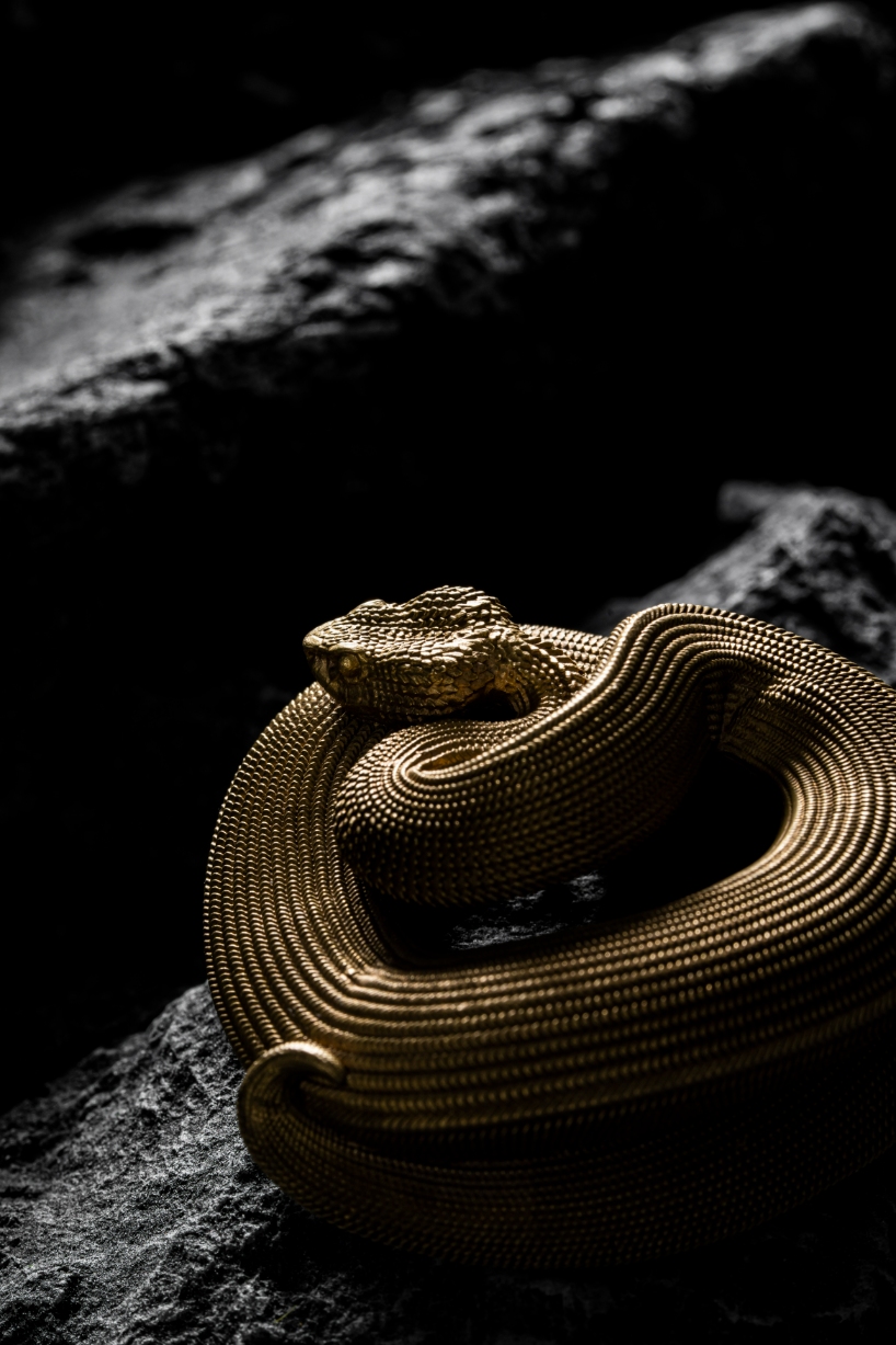 coppertist.wu hand engraves over 14,000 scales on this elegant viper bottle opener