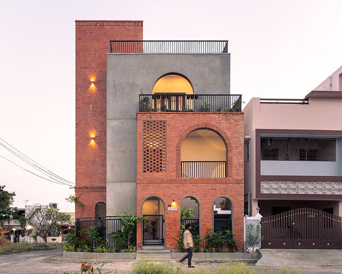 a series of concrete and brick arches sculpts residence in india