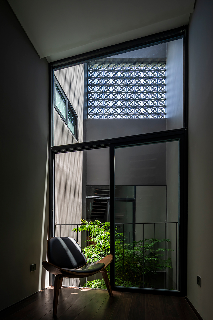 pham huu son weaves small green gardens throughout this sustainable home in vietnam