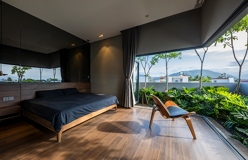 pham huu son weaves small green gardens throughout this sustainable home in vietnam