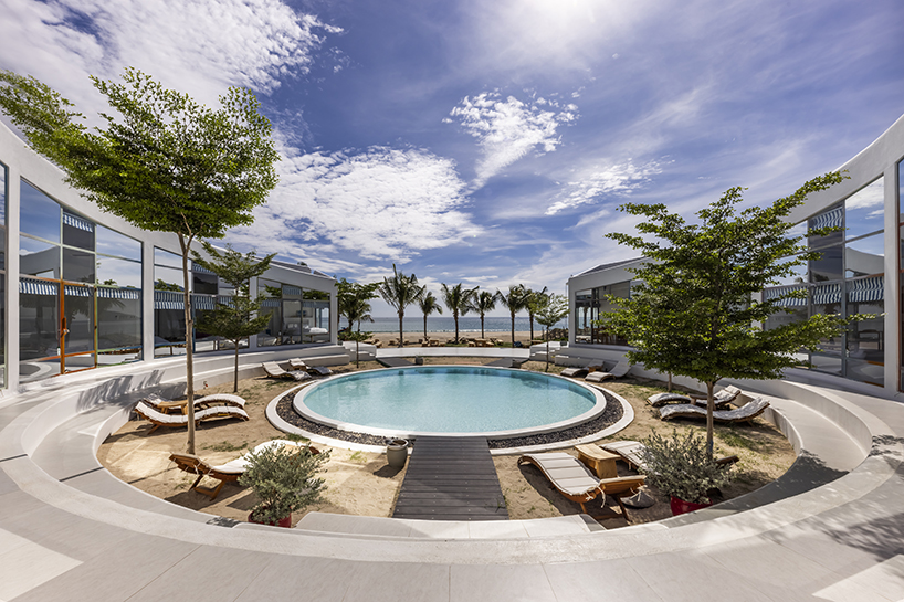 pham huu son renders mediterranean-style beach resort in vietnam in white lime