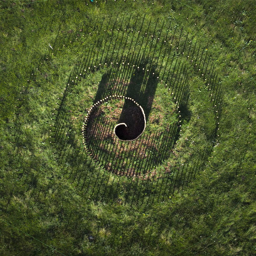 mathieu nouhen's spiral land art conjures mystical undertones in