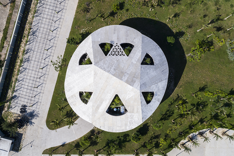 living and working spaces coexist under a roof amid vietnamese coastal landscape 2