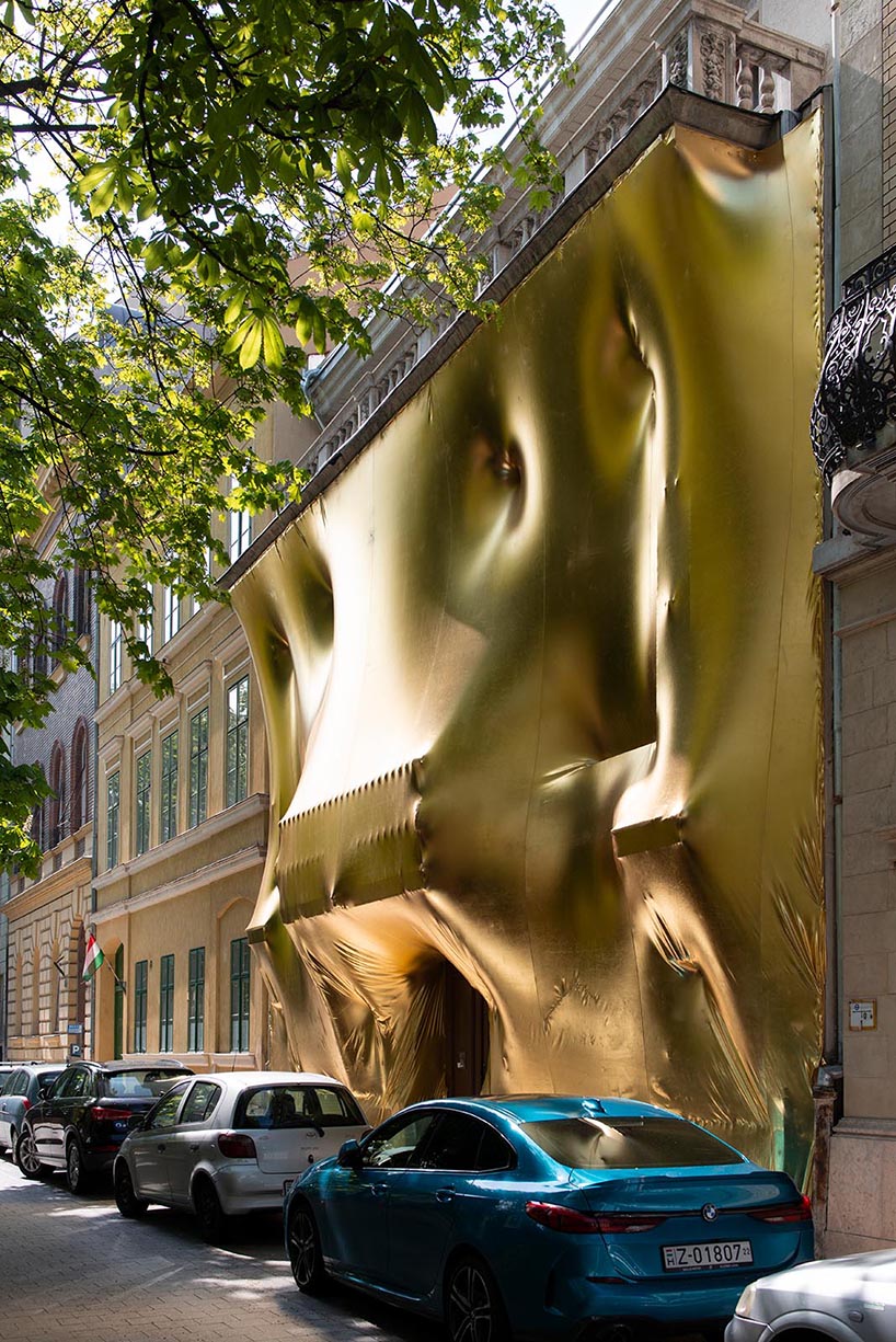 19th-century palaces wrapped in reflective gold by pyxis nautica and dániel szalai transform budapest streetscapes