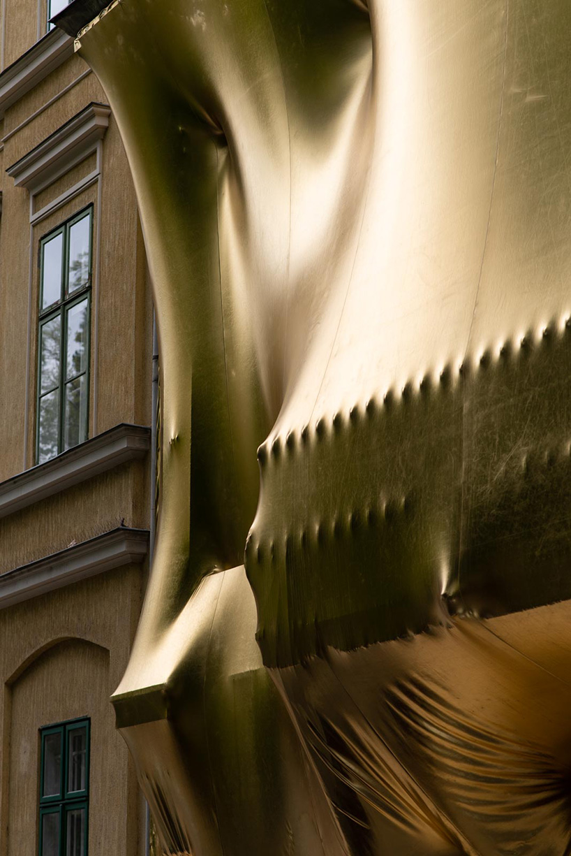 19th-century palaces wrapped in reflective gold by pyxis nautica and dániel szalai transform budapest streetscapes