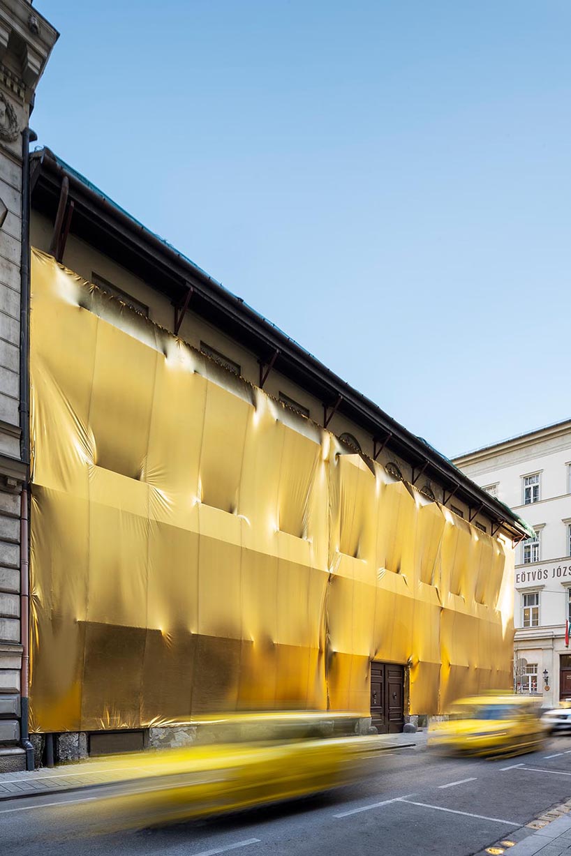 19th-century palaces wrapped in reflective gold by pyxis nautica and dániel szalai transform budapest streetscapes