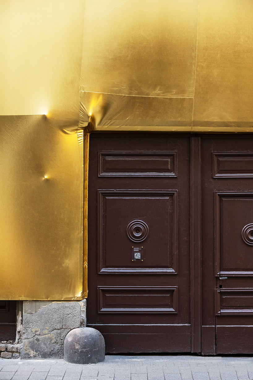 19th-century palaces wrapped in reflective gold by pyxis nautica and dániel szalai transform budapest streetscapes