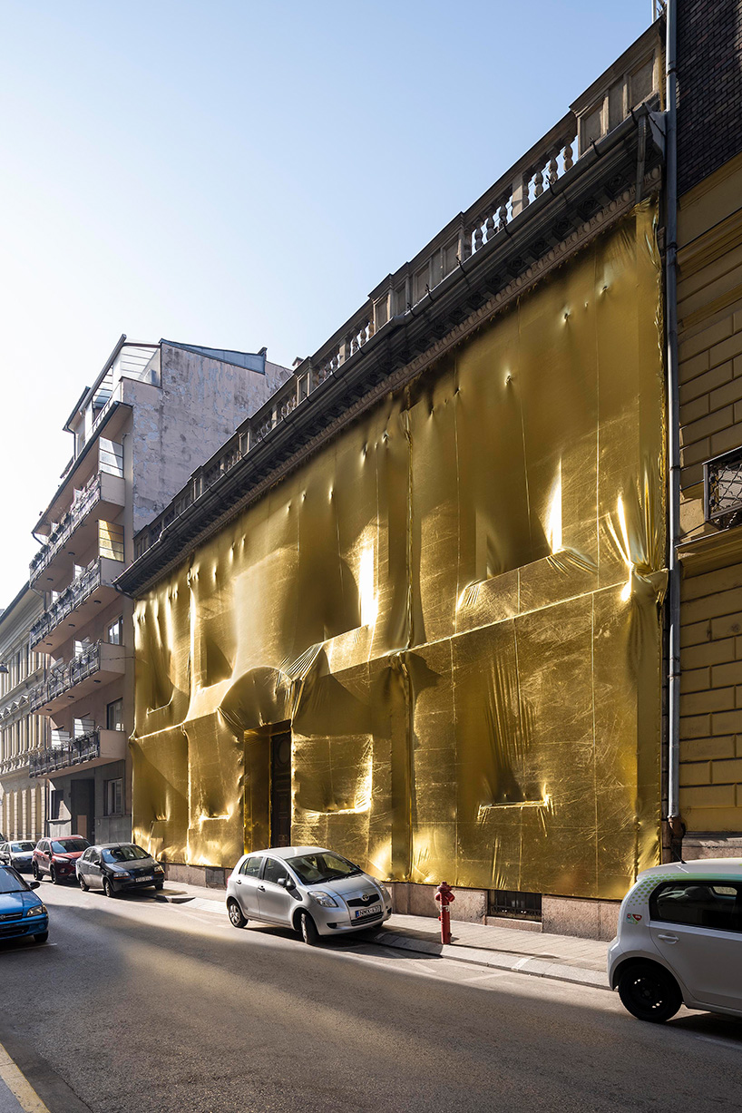 19th-century palaces wrapped in reflective gold by pyxis nautica and dániel szalai transform budapest streetscapes