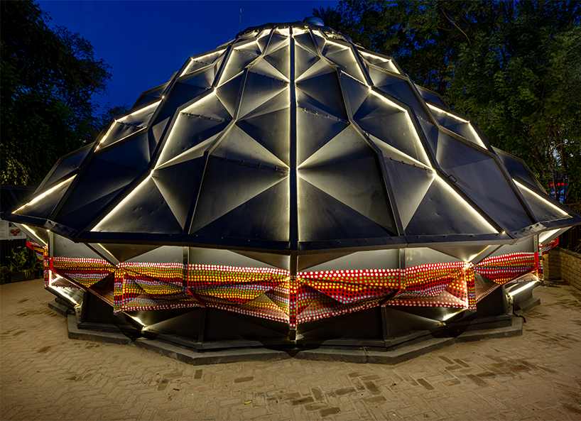parametric metal tent with ridge paneled facade serves as multipurpose events space by andblack studio in india