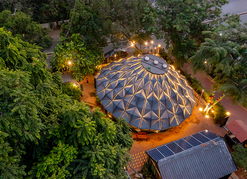 parametric metal tent with ridge paneled facade serves as multipurpose events space by andblack studio in india