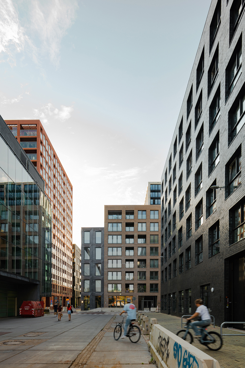 studioninedots' oostenburg island replan blends industrial heritage with urban density