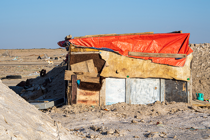 aljohara jeje captures primitive homes made of recycled construction materials + driftwood