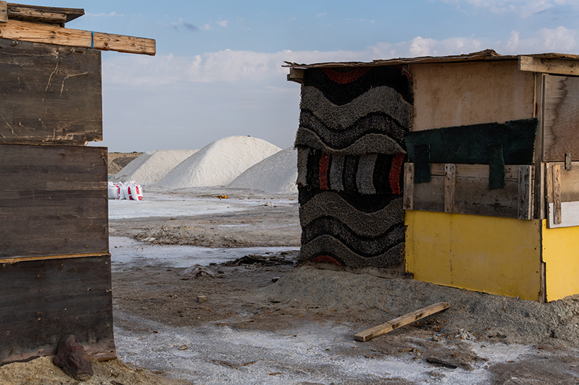 aljohara jeje captures primitive homes made of recycled construction materials + driftwood