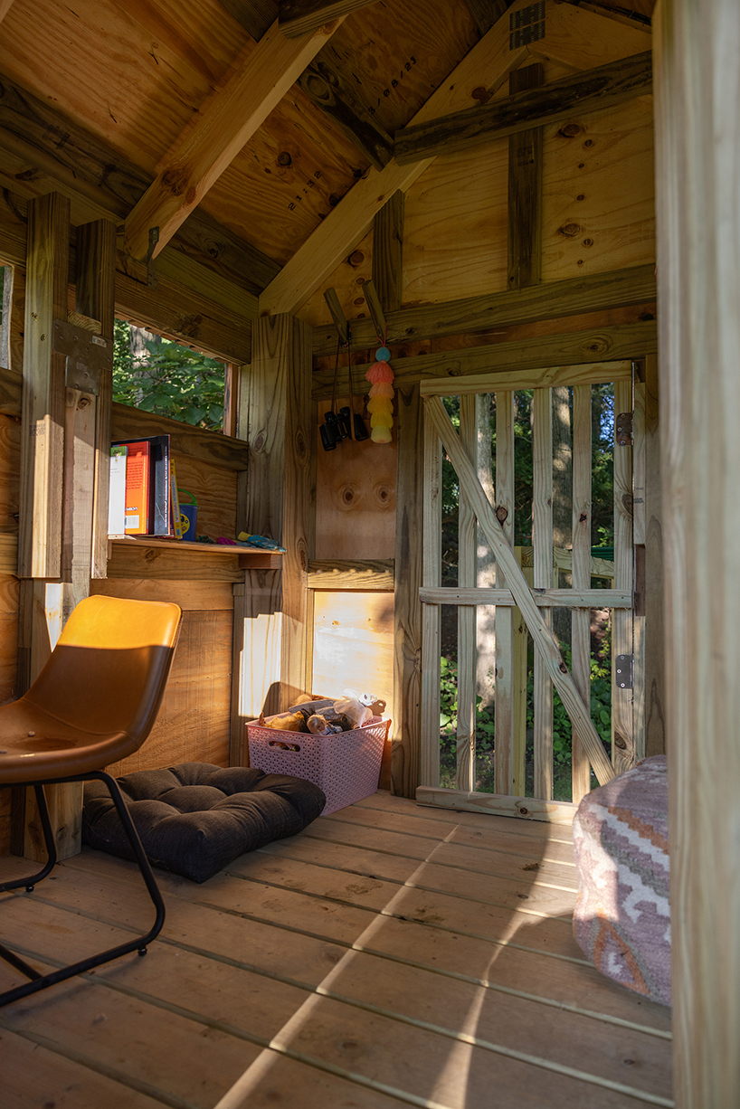 temescal sustainable agency upcycles twin treehouses off a lakeside forest 11