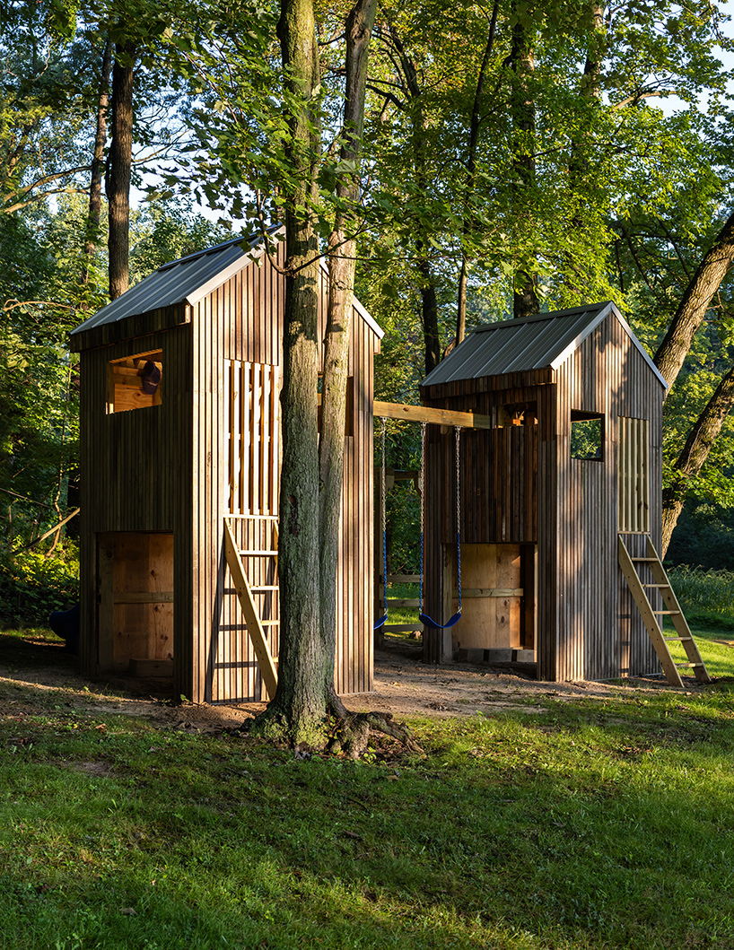 temescal sustainable agency upcycles twin treehouses off a lakeside forest 6