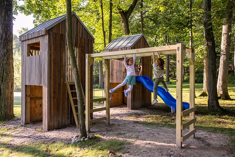 temescal sustainable agency upcycles twin treehouses off a lakeside forest 9