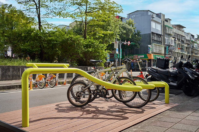 winding tube rack reclaims bustling urban spaces for bike parking and public seating in taipei