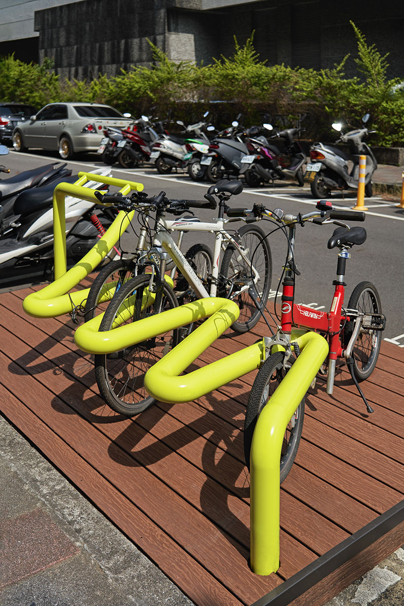 winding tube rack reclaims bustling urban spaces for bike parking and public seating in taipei