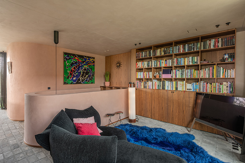 rounded volume made of walnut wood lies in the heart of penthouse T by objekt architecten - 2