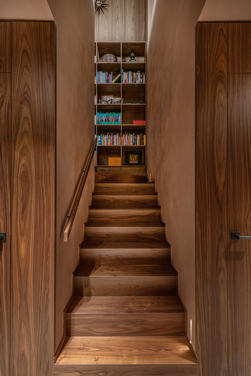 rounded volume made of walnut wood lies in the heart of penthouse T by objekt architecten - 8
