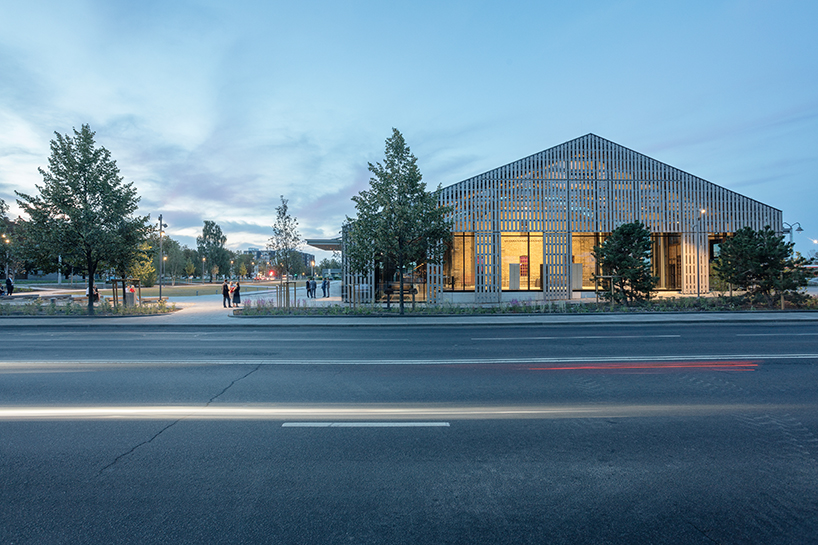 historic latvian cargo warehouse by sudraba arhitektura revived as cultural center, encased in glass and steel shell