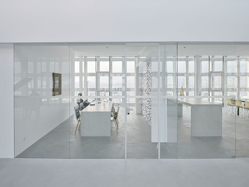 concrete crown by obsermoser + partner architekten transforms a 1978 grain silo into a storing-center for wood pellets