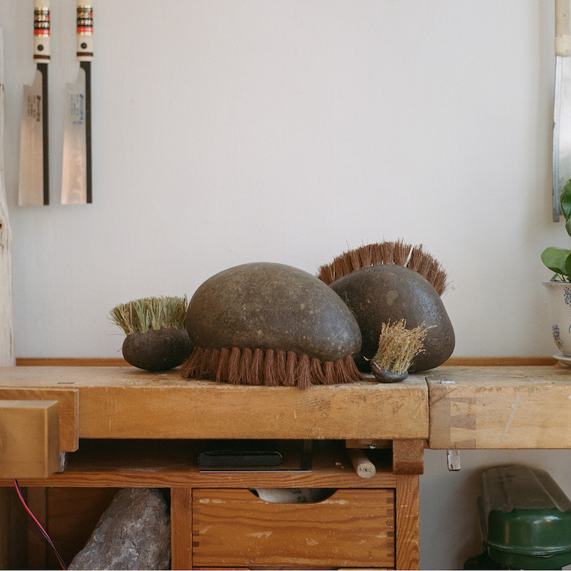 thomas yang's organic stone brush rooted in nature transforms mundane act of sweeping