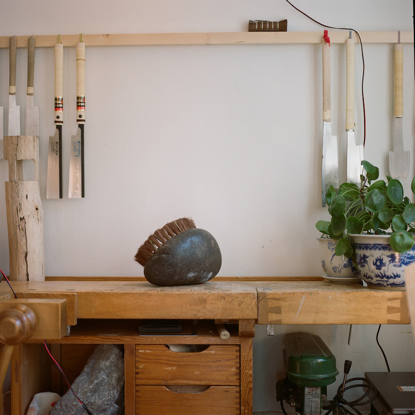 thomas yang's organic stone brush rooted in nature transforms mundane act of sweeping