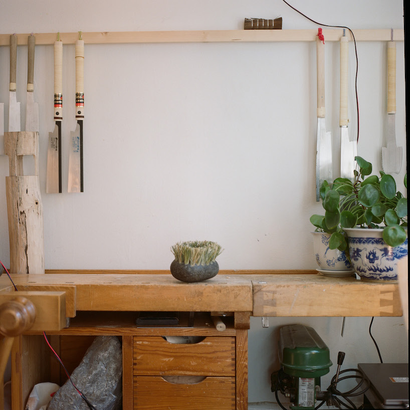 thomas yang's organic stone brush rooted in nature transforms mundane act of sweeping