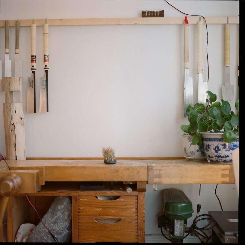 thomas yang's organic stone brush rooted in nature transforms mundane act of sweeping