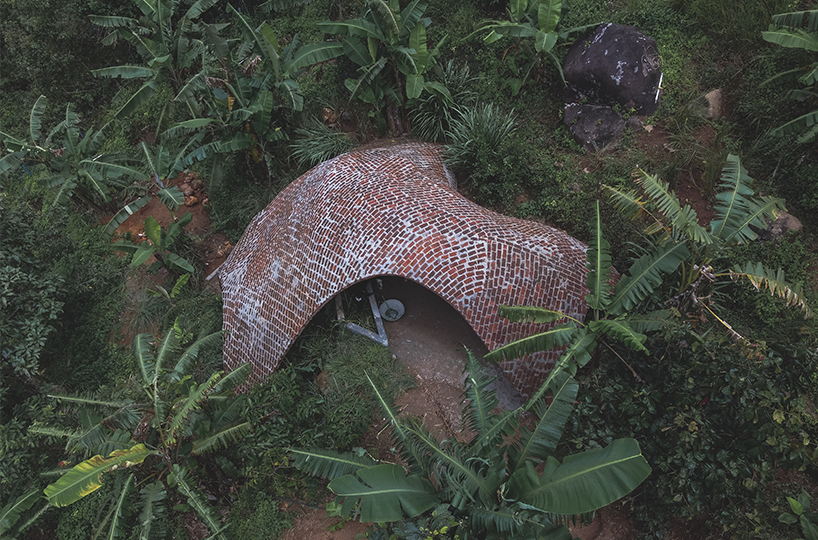 earthscape studio's vaulted cowshed nestles into kerala's hillside