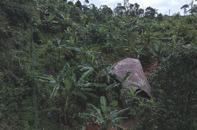 earthscape studio's vaulted cowshed nestles into kerala's hillside