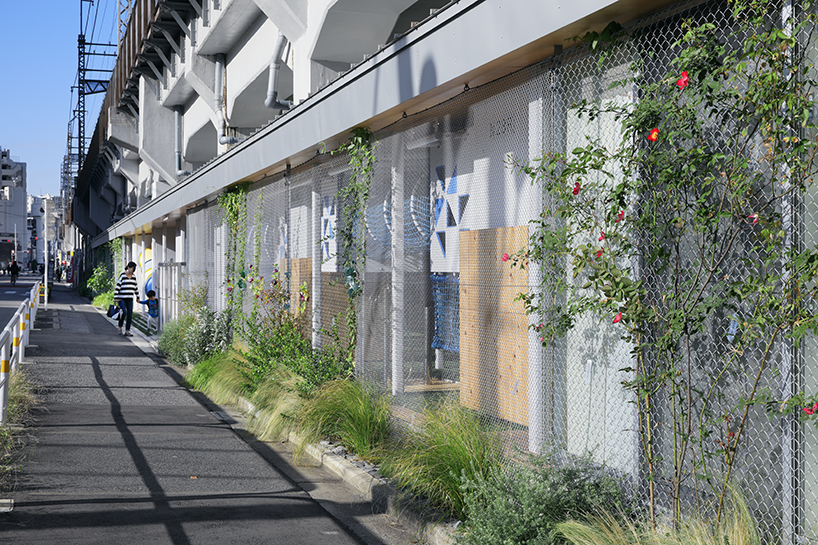 takahiro akiyama architects revives vacant lot under tokyo railway line as school