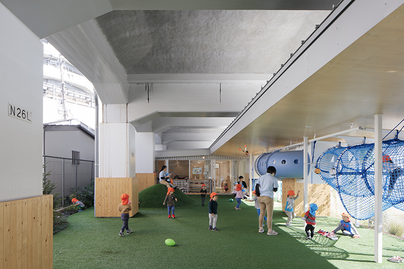 takahiro akiyama architects revives vacant lot under tokyo railway line as school
