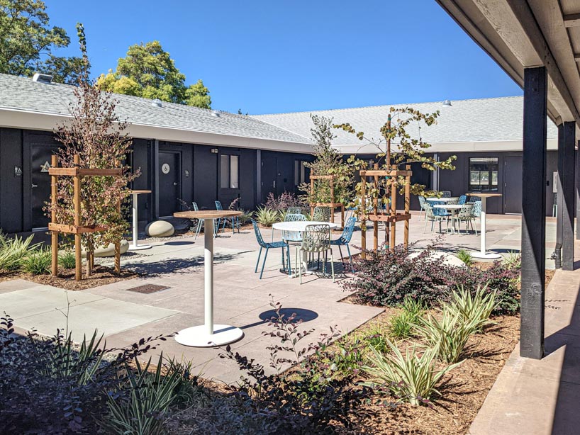 university research facility expands under floating asymmetrical pitched roof in california - 2