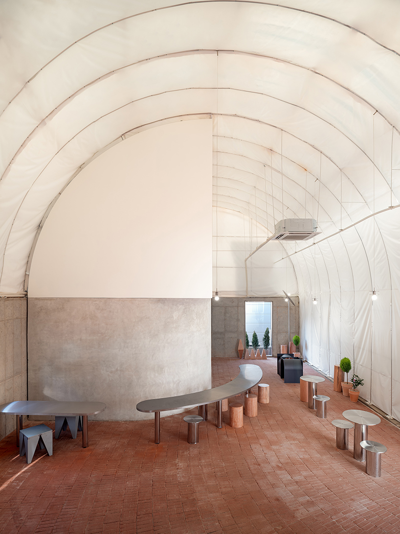 sukchulmok studio imposes PTFE tents onto concrete for photography studio in south korea