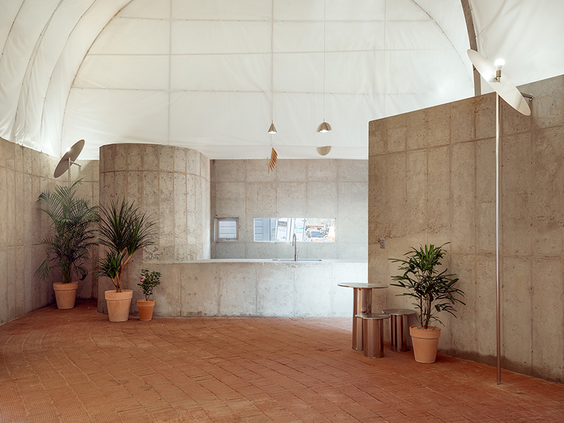 sukchulmok studio imposes PTFE tents onto concrete for photography studio in south korea