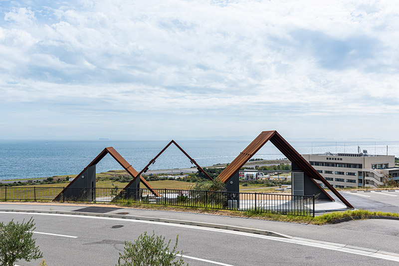ensemble of pitched steel volumes form oharchitecture's bbq terrace in awaji, japan