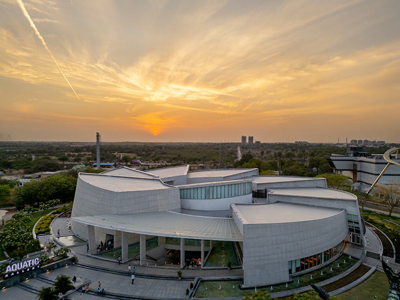 spiraling like a nautilus, INI design studio's aquatic gallery in india fosters immersive learning