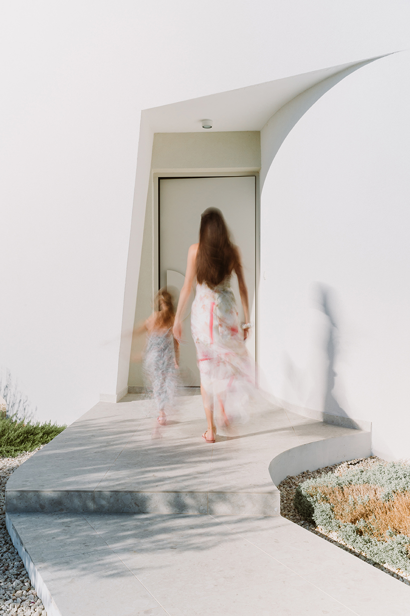 cypress-lined landscape embraces versa architecture's villa JJ in cyprus