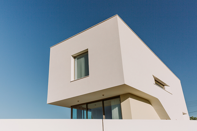 cypress-lined landscape embraces versa architecture's villa JJ in cyprus