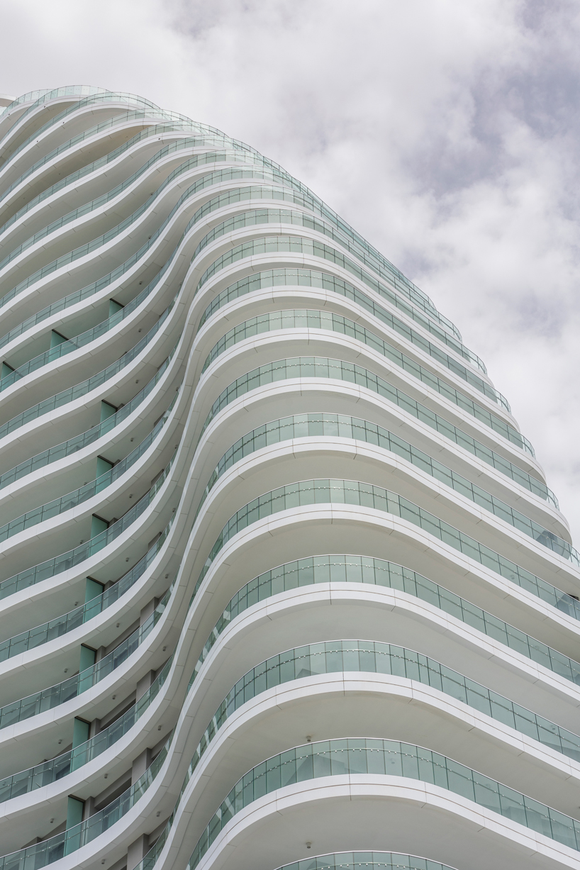 two rippling volumes unite luxury commercial and residential spaces at limassol del mar, cyprus