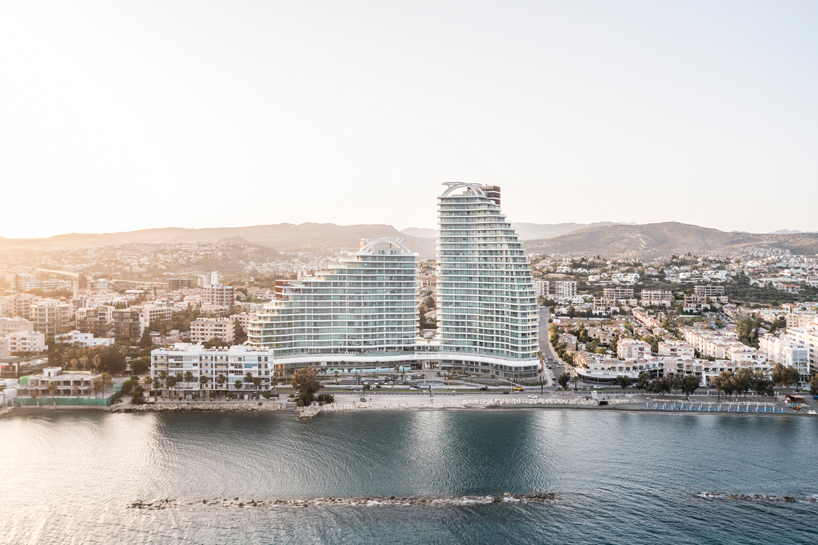 two rippling volumes unite luxury commercial and residential spaces at limassol del mar, cyprus