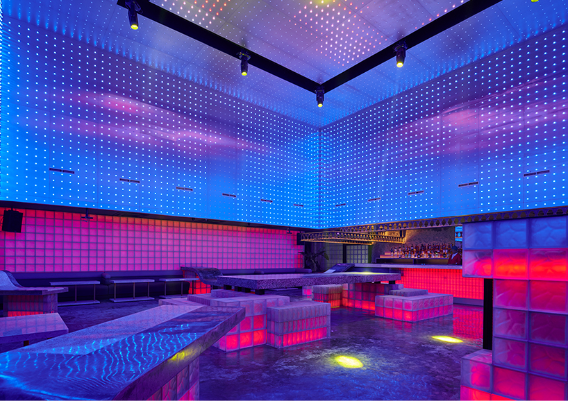 neon lights permeate glass block walls of renovated hidden basement bar in indonesia - 6