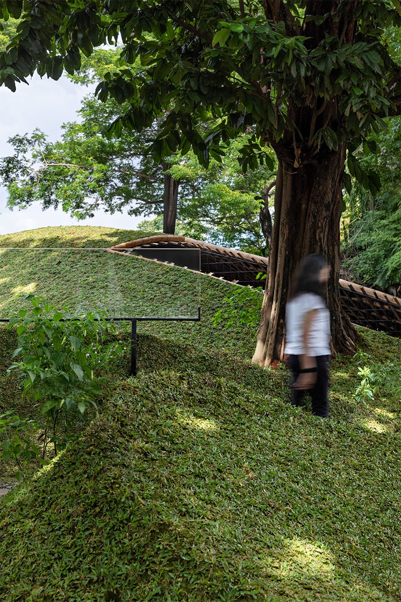 woven bamboo encloses urban chicken coop pavilion in jakarta park by RAD+ar