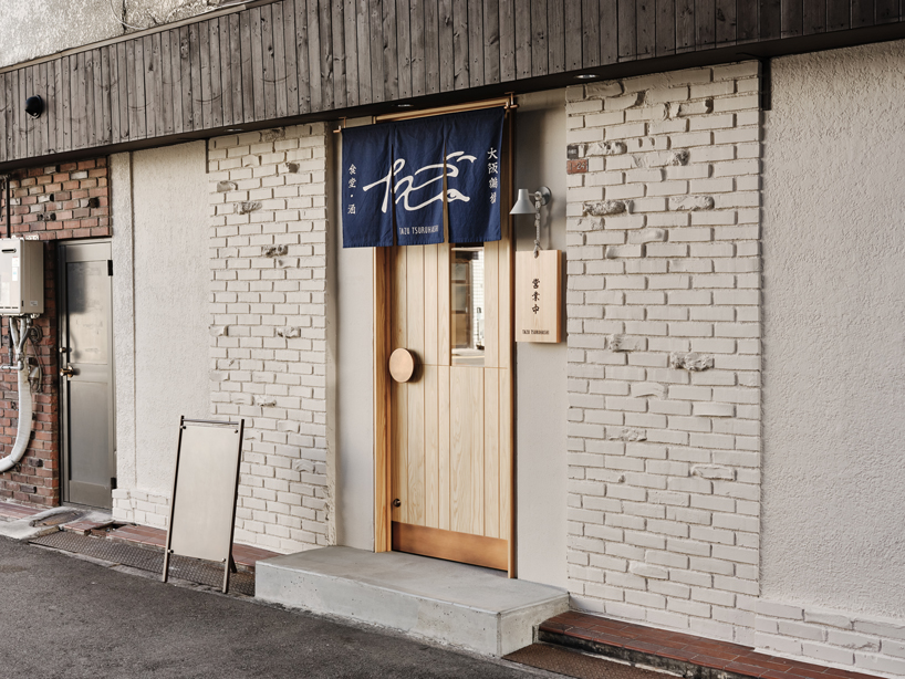 renovated restaurant by stod preserves its historic brick frame in japan - 1
