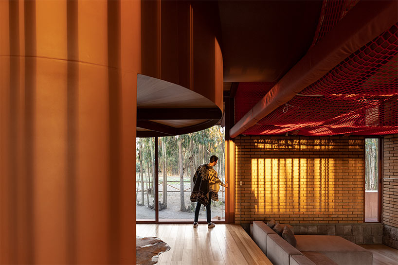 gabriel rivera arquitectos tucks home & stables amid expanse of eucalyptus trees in ecuador