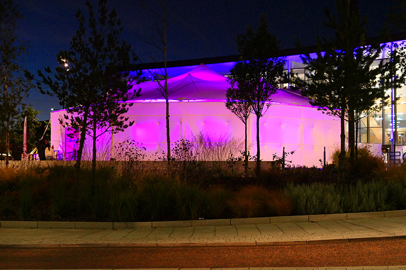 mobile event tent serves as adaptable arts center to foster community access across england