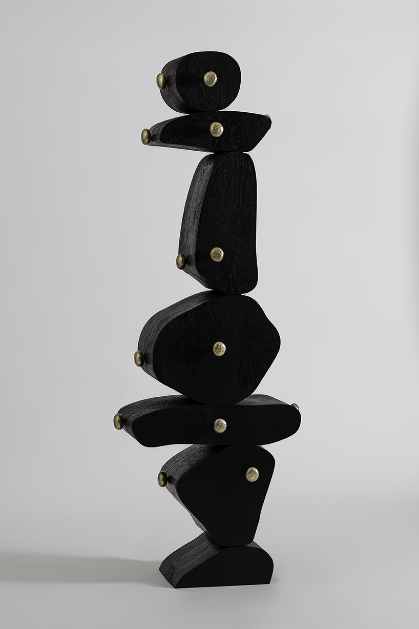 irregularly stacked volumes capture the korean tradition of wish-making in jaewoo ahn's wooden cabinet